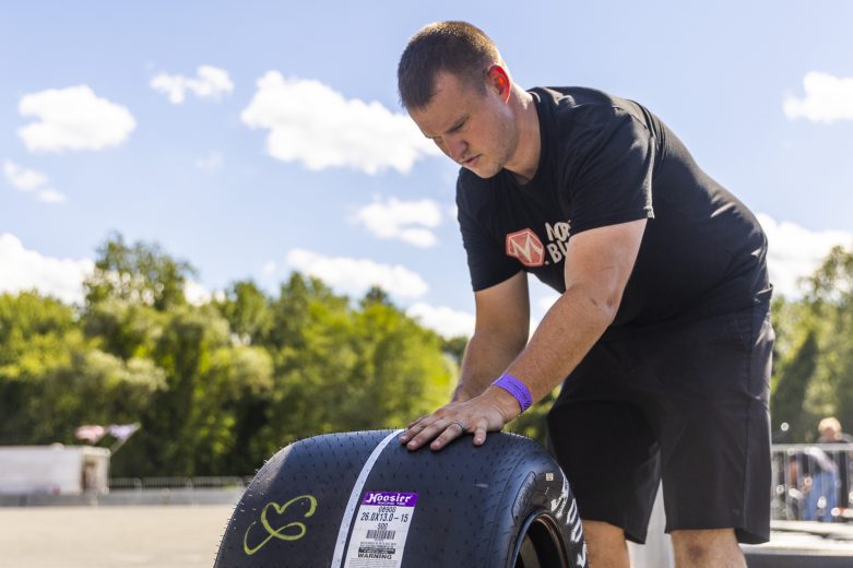 Ryan Preece, driver of the #44 Harshaw Paving / Olivas Market, works on his tires during the Phoenix Communications 150 for the Whelen Modified Tour at Thompson Speedway Motorsports Park on August 18, 2022 in Claremont, New Hampshire. (Adam Glanzman/NASCAR)