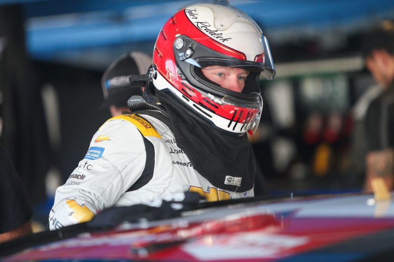 Tyler Reddick hops into his car during Day 1 of the Martinsville Speedway organizational test