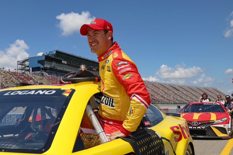 BROOKLYN, MICHIGAN - AUGUST 06: Joey Logano, driver of the #22 Shell Pennzoil Ford, exits his car during qualifying for the NASCAR Cup Series FireKeepers Casino 400 at Michigan International Speedway on August 06, 2022 in Brooklyn, Michigan. (Photo by Mike Mulholland/Getty Images) | Getty Images