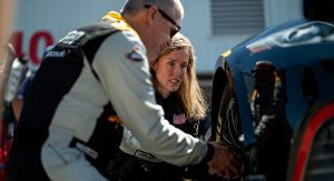 NBC Sports analyst Jeff Burton shows Kolby Garrison the features of the Next Gen wheel