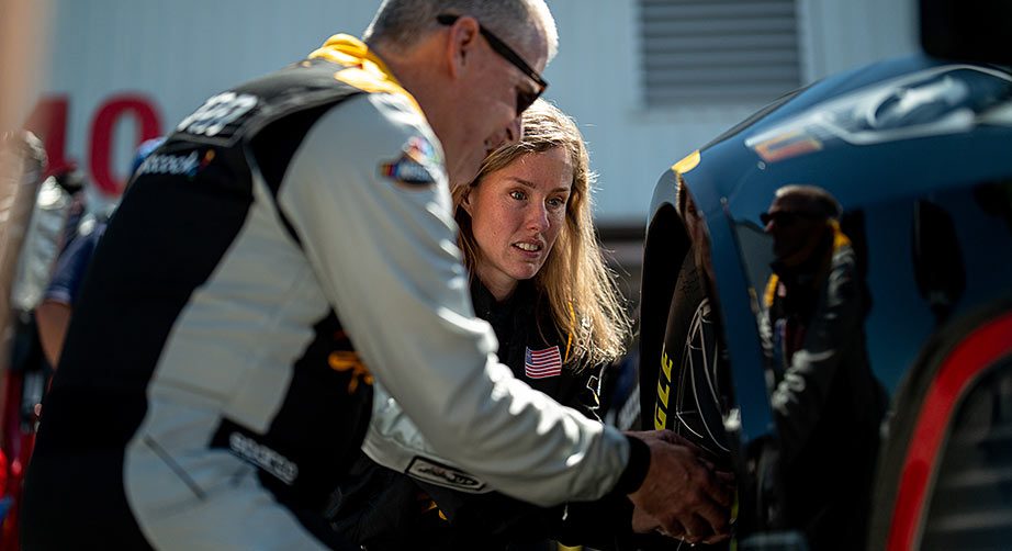 NBC Sports analyst Jeff Burton shows Kolby Garrison the features of the Next Gen wheel