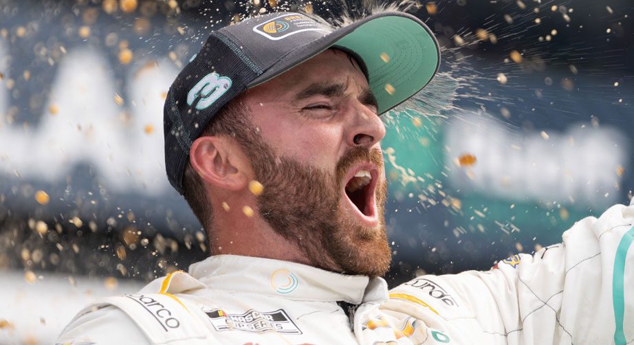 A close-up shot of Austin Dillon celebrating in Victory Lane