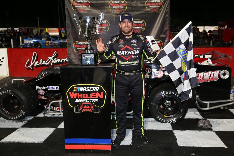 Doug Coby, driver of the #7 John Blewett Inc. Modified celebrates winning the CheckeredFlag.com 150 for the NASCAR Whelen Modified Tour at Larry King Law's Langley Speedway on August 27, 2022 in Hampton, Virginia. (Ryan M. Kelly/NASCAR)