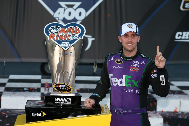 JOLIET, IL - SEPTEMBER 20: Denny Hamlin, driver of the #11 FedEx Ground Toyota, poses with the myAFibRisk.com 400 trophy after winning the NASCAR Sprint Cup Series myAFibRisk.com 400 at Chicagoland Speedway on September 20, 2015 in Joliet, Illinois. (Photo by Sean Gardner/Getty Images) | Getty Images