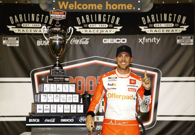 DARLINGTON, SOUTH CAROLINA - SEPTEMBER 05: Denny Hamlin, driver of the #11 Offerpad Toyota, celebrates in the Ruoff Mortgage victory lane after winning the NASCAR Cup Series Cook Out Southern 500 at Darlington Raceway on September 05, 2021 in Darlington, South Carolina. (Photo by Jared C. Tilton/Getty Images) | Getty Images