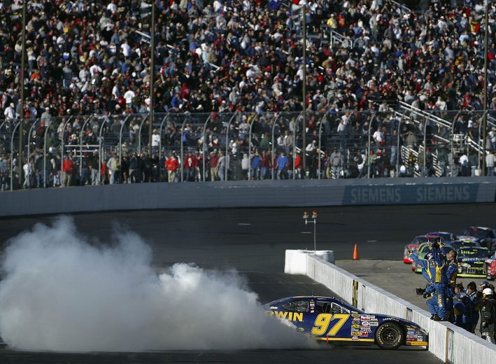 LOUDON, NH - SEPTEMBER 19: Kurt Busch, driver of the #97 IRWIN Industrial Tools Ford, celebrates after winning the NASCAR Nextel Cup Series Sylvania 300 on September 19, 2004 at New Hampshire International Speedway in Loudon, New Hampshire. (Photo by Gavin Lawrence/Getty Images). | Getty Images