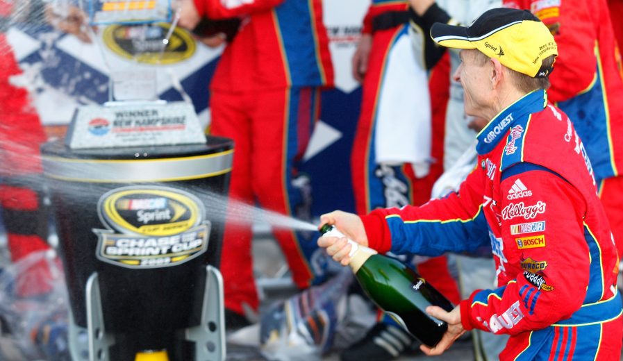 LOUDON, NH - SEPTEMBER 20: Mark Martin, driver of the #5 CARQUEST/Kellogg's Chevrolet, celebrates in victory lane during the NASCAR Sprint Cup Series Sylvania 300 at the New Hampshire Motor Speedway on September 20, 2009 in Loudon, New Hampshire. (Photo by Geoff Burke/Getty Images for NASCAR) | Getty Images