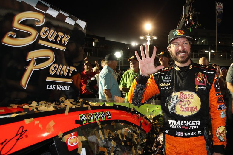 LAS VEGAS, NEVADA - SEPTEMBER 15: Martin Truex Jr., driver of the #19 Bass Pro Shops Toyota, places the winner's sticker on his car after winning the Monster Energy NASCAR Cup Series South Point 400 at Las Vegas Motor Speedway on September 15, 2019 in Las Vegas, Nevada. (Photo by Chris Graythen/Getty Images) | Getty Images