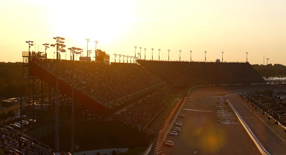 The sun sets behind the grandstands at Darlington.