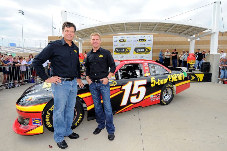 KANSAS CITY, KS - OCTOBER 07: (L-R) Team owner Michael Waltrip and driver Clint Bowyer pose by the #15 5-Hour Energy Toyota at Kansas Speedway on October 7, 2011 in Kansas City, Kansas. Waltrip announced that Clint Bowyer will join Michael Waltrip Racing for the 2012 Season. (Photo by Jason Smith/Getty Images for NASCAR) | Getty Images