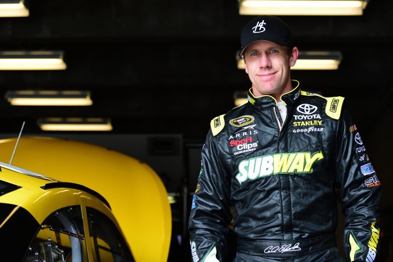 INDIANAPOLIS, IN - APRIL 29: Carl Edwards, driver of the #19 Joe Gibbs Racing Toyota, walks through the garage area during NASCAR Sprint Cup Series testing at Indianapolis Motor Speedway on April 29, 2015 in Indianapolis, Indiana. (Photo by Jared C. Tilton/NASCAR via Getty Images)