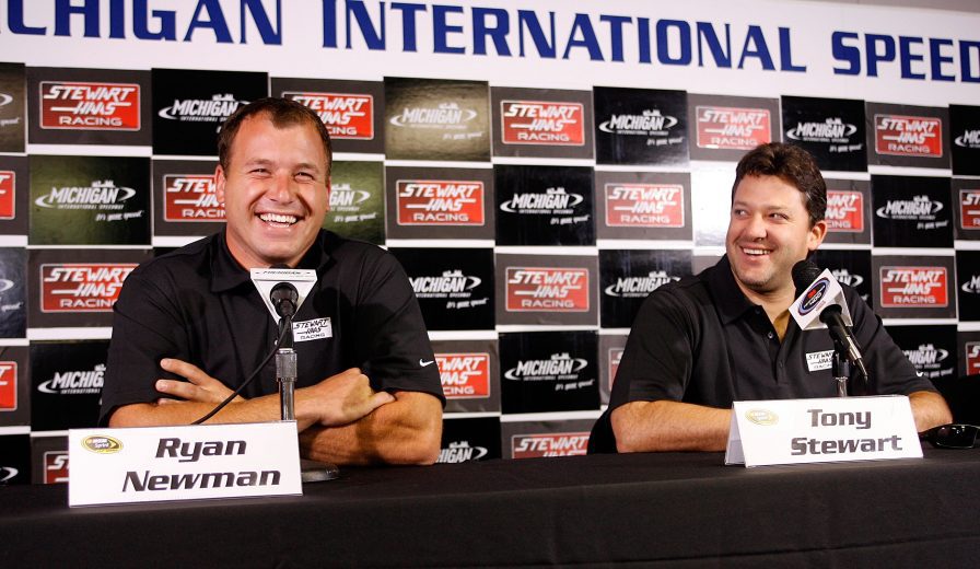 BROOKLYN, MI - AUGUST 15: Ryan Newman (L), driver of the #12 alltel Dodge, and Tony Stewart, driver of the #20 Home Depot Toyota, speak to the media during a press conference announcing Newman becoming a driver for Stewart / Haas Racing for the 2009 season prior to practice for the NASCAR Sprint Cup Series 3M Performance 400 at Michigan International Speedway on August 15, 2008 in Brooklyn, Michigan. (Photo by Geoff Burke/Getty Images for NASCAR) | Getty Images