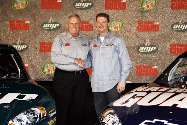 DALLAS, TX - SEPTEMBER 19: Dale Earnhardt Jr. (R) of the Hendrick Motorsports Racing Team poses with Rick Hendrick and his new cars on September 19, 2007 at the Dallas Convention Center in Dallas, Texas. (Photo by Layne Murdoch/Getty Images) | Getty Images