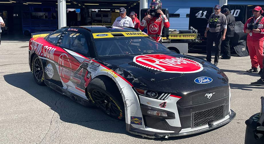 Kevin Harvick exits his damaged No. 4 Ford in the Cup Series garage at Kansas Speedway