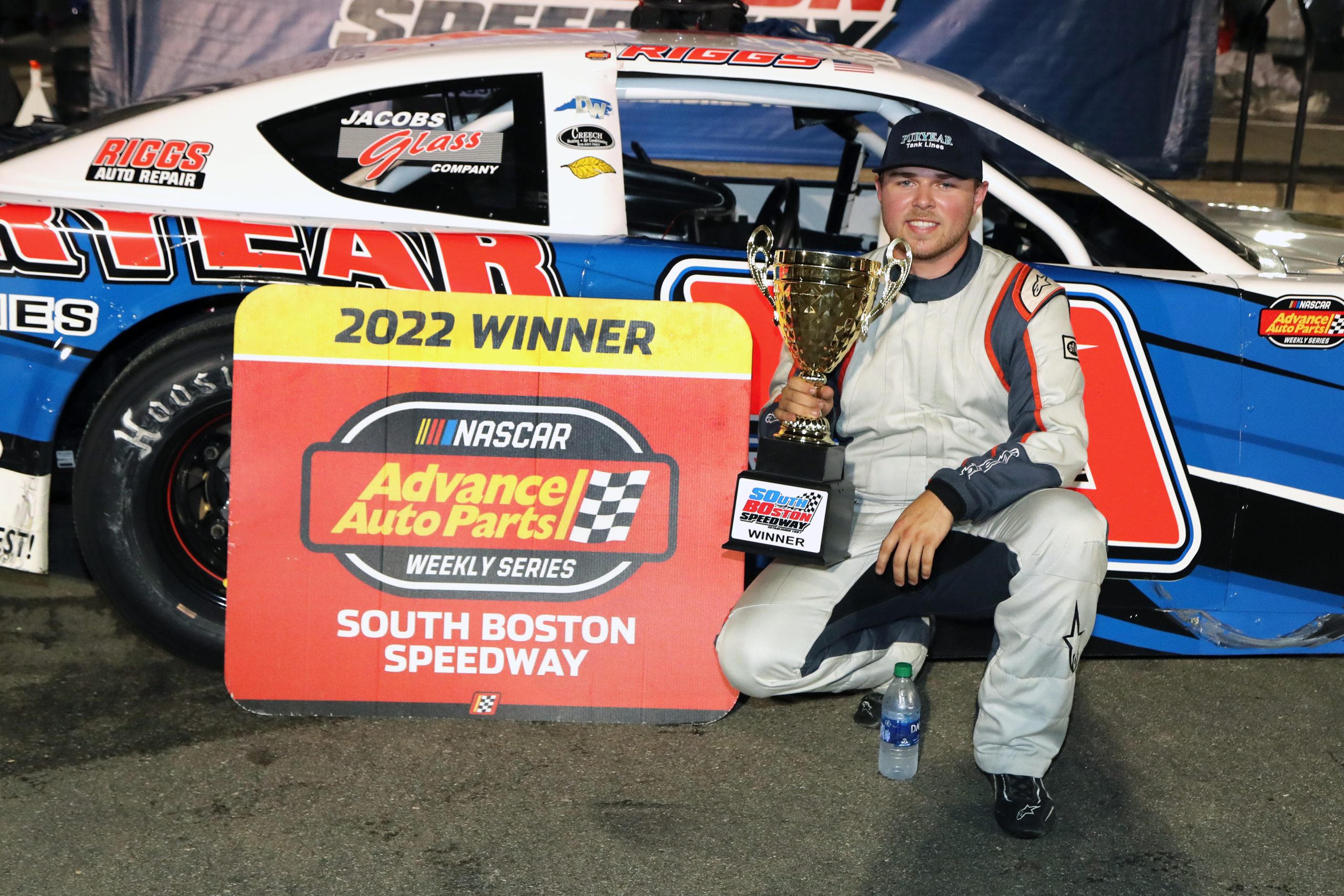 Layne Riggs displays the winner’s trophy in Victory Lane after sweeping the NASCAR Advance Auto Parts Weekly Series Late Model Stock Car Division twinbill on July 16 at South Boston Speedway. (Joe Chandler/South Boston Speedway)