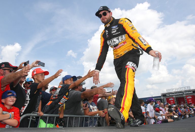 BROOKLYN, MICHIGAN - AUGUST 07: Chase Briscoe, driver of the #14 Rush Truck Centers/Cummins Ford, greets fans during driver intros prior to the NASCAR Cup Series FireKeepers Casino 400 at Michigan International Speedway on August 07, 2022 in Brooklyn, Michigan. (Photo by Sean Gardner/Getty Images) | Getty Images