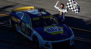 Chase Elliott celebrates with the checkered flag at Talladega Superspeedway