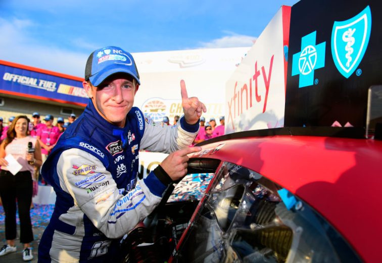 CHARLOTTE, NORTH CAROLINA - SEPTEMBER 28: A J Allmendinger, driver of the #10 Digital Ally Chevrolet, poses with the winner’s decal on his car in Victory Lane after winning the NASCAR Xfinity Series Drive for the Cure 250 presented by Blue Cross Blue Shield of North Carolina at Charlotte Motor Speedway on September 28, 2019 in Charlotte, North Carolina. (Photo by Jared C. Tilton/Getty Images) | Getty Images