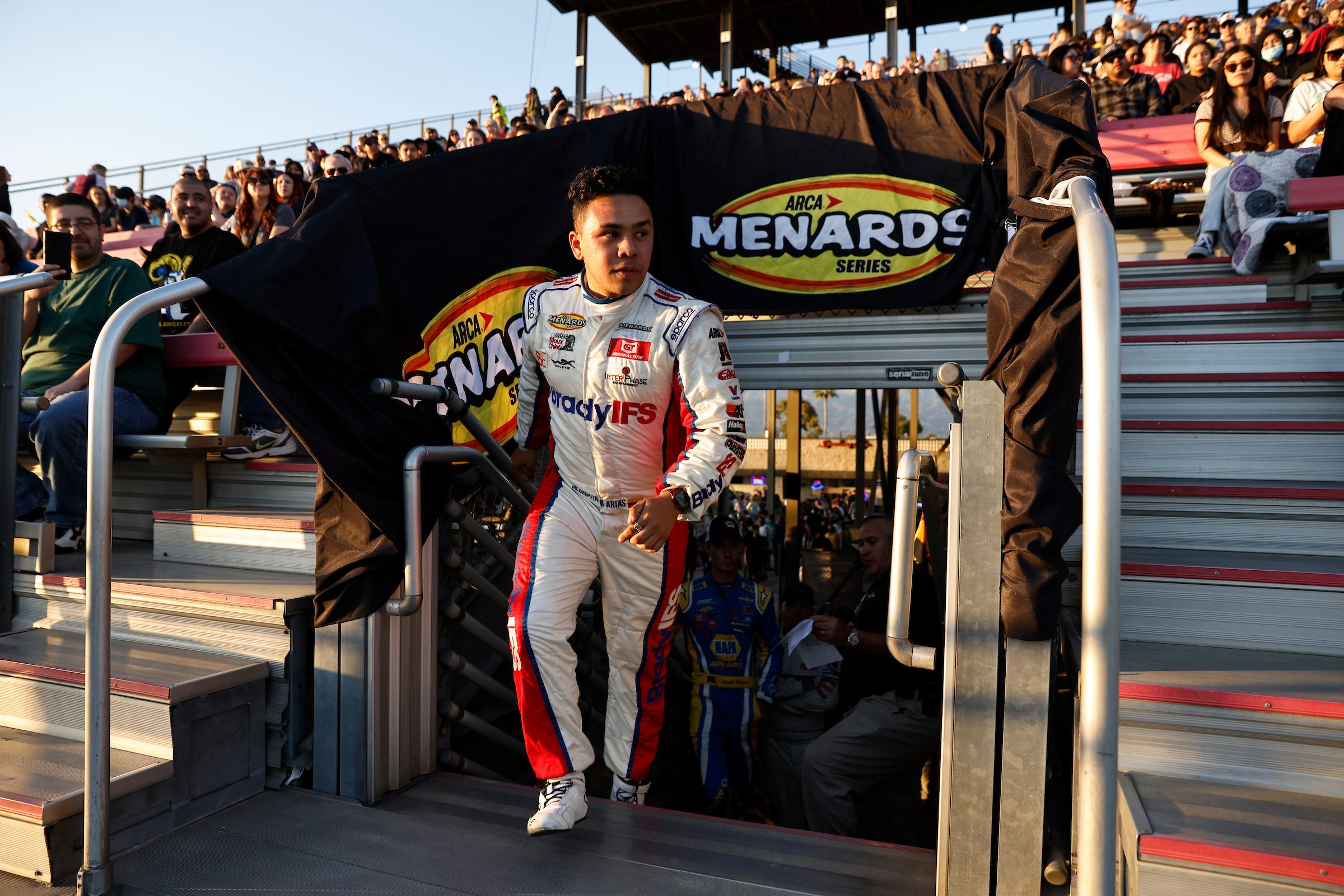 Sebastian Arias, driver of the #4 Brady IFS-Rubbermaid Products-Betco Toyota, addresses the crowd as he is introduced prior to the NAPA Auto Parts 150 presented by West Coast Stock Car Hall of Fame for the ARCA Menards Series West at Irwindale Speedway in Irwindale, California on March 26, 2022. (Michael Owens/ARCA Racing)