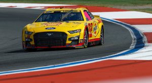 Joey Logano's No. 22 Ford drives through the infield portion of the Charlotte Motor Speedway Roval