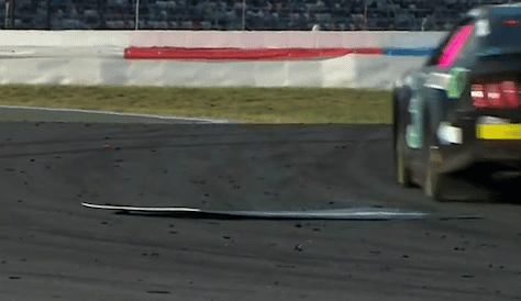 Uh oh, we’ve got debris on the track! That’ll put a wrench in things: caution with five laps to go.
