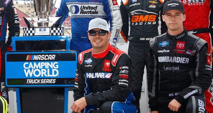 stewart friesen and ben rhodes next to the trucks trophy