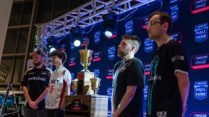 eNASCAR iRacing championship contenders flank the trophy