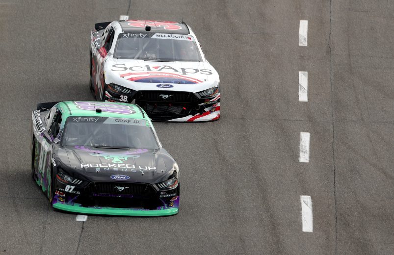MARTINSVILLE, VIRGINIA - OCTOBER 28: Joe Graf Jr, driver of the #07 Bucked Up Energy Ford, and CJ McLaughlin, driver of the #38 SciAps Ford, drive during practice for the NASCAR Xfinity Series Dead On Tools 250 at Martinsville Speedway on October 28, 2022 in Martinsville, Virginia. (Photo by Stacy Revere/Getty Images) | Getty Images