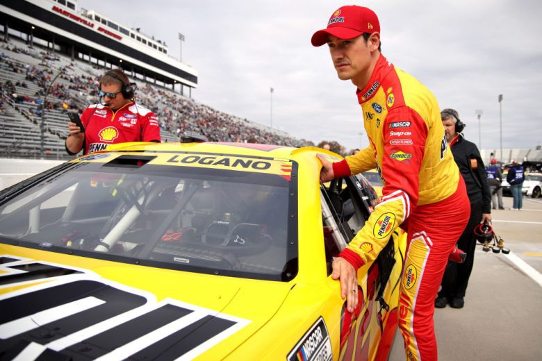 Joey Logano climbs into his car