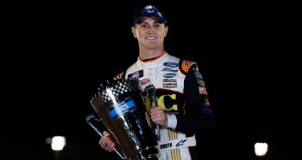 Zane Smith poses with the 2022 Truck Series trophy