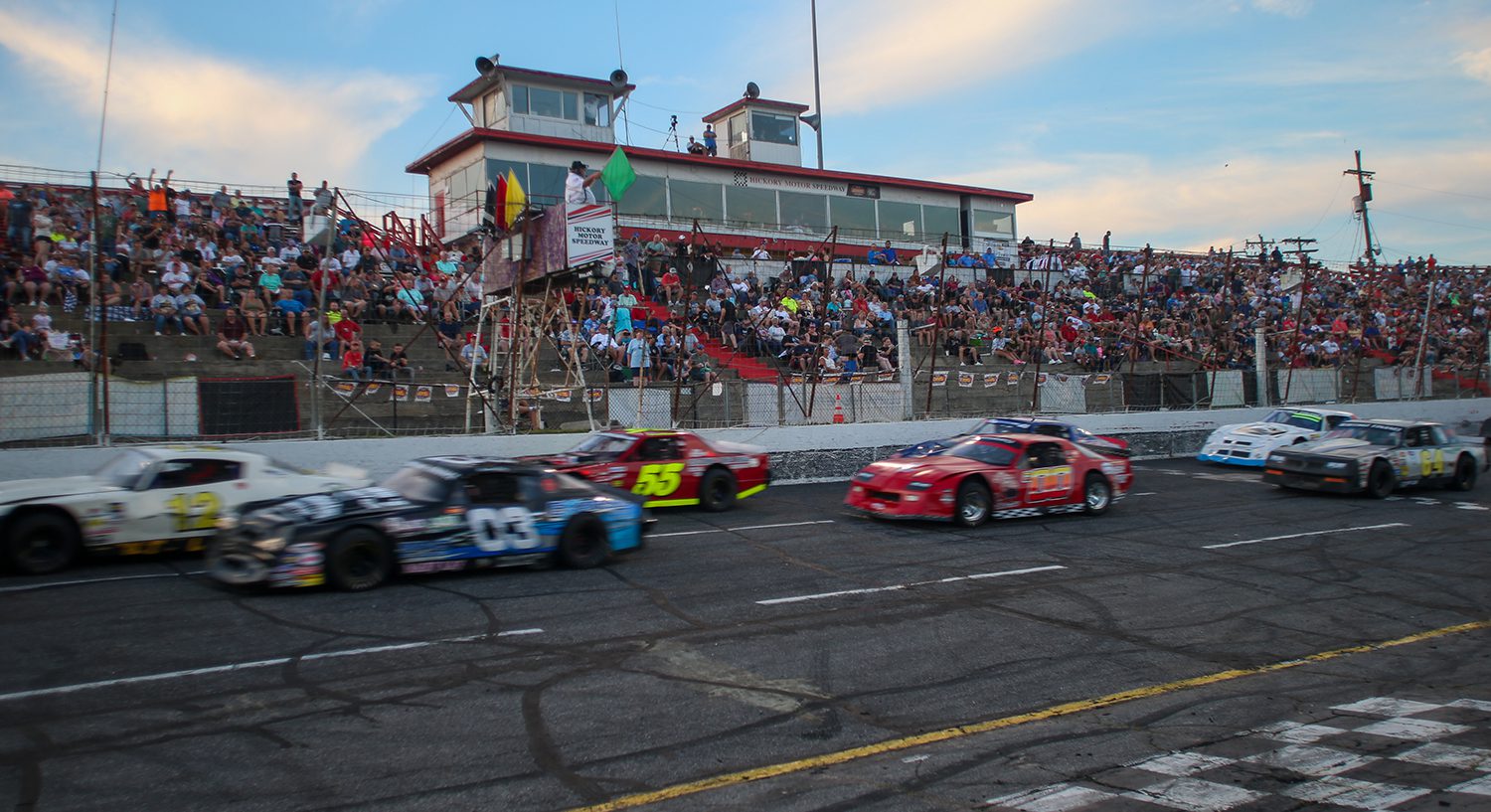 Street stocks flash past the grandstands during the Jack Ingram Memorial at Hickory Motor Speedway in North Carolina on June 11, 2022. (Adam Fenwick/NASCAR)