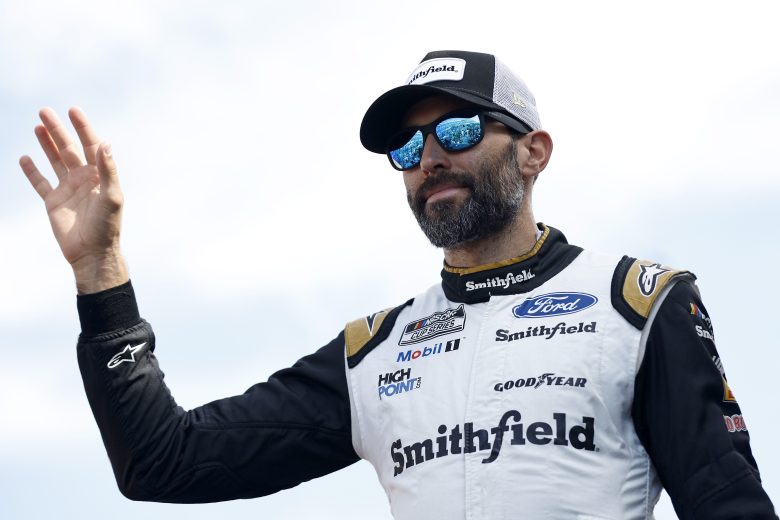 LAS VEGAS, NEVADA - OCTOBER 16: Aric Almirola, driver of the #10 Haas Automation Ford, waves to fans as he walks onstage during driver intros prior to the NASCAR Cup Series South Point 400 at Las Vegas Motor Speedway on October 16, 2022 in Las Vegas, Nevada. (Photo by Sean Gardner/Getty Images) | Getty Images