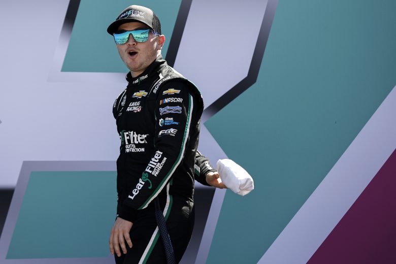 HOMESTEAD, FLORIDA - OCTOBER 23: Justin Haley, driver of the #31 LeafFilter Gutter Protection Chevrolet, throws t-shirts to fans as he walks onstage during driver intros prior to the NASCAR Cup Series Dixie Vodka 400 at Homestead-Miami Speedway on October 23, 2022 in Homestead, Florida. (Photo by Sean Gardner/Getty Images) | Getty Images