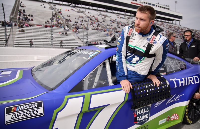 MARTINSVILLE, VIRGINIA - OCTOBER 29: Chris Buescher, driver of the #17 Fifth Third Bank Ford, enters his car during qualifying for the NASCAR Cup Series Xfinity 500 at Martinsville Speedway on October 29, 2022 in Martinsville, Virginia. (Photo by Mike Mulholland/Getty Images) | Getty Images