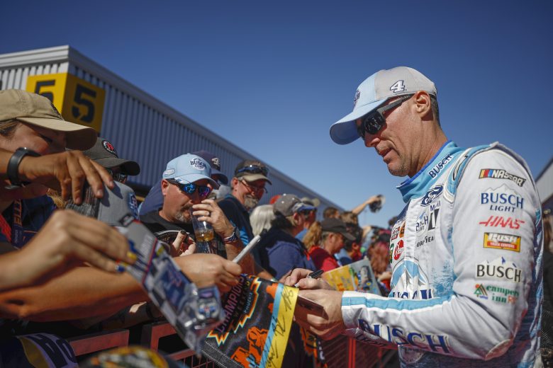 AVONDALE, ARIZONA - NOVEMBER 06: Kevin Harvick, driver of the #4 Busch Light Ford, signs autographs for NASCAR fans on the red carpet prior to to the NASCAR Cup Series Championship at Phoenix Raceway on November 06, 2022 in Avondale, Arizona. (Photo by Jared C. Tilton/Getty Images) | Getty Images