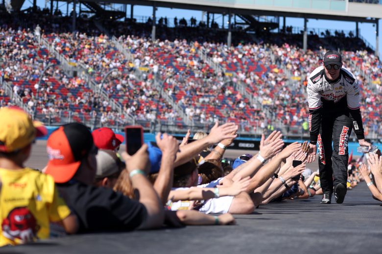 AVONDALE, ARIZONA - NOVEMBER 06: Austin Cindric, driver of the #2 Discount Tire Ford, greets fans as he walks onstage during driver intros prior to the NASCAR Cup Series Championship at Phoenix Raceway on November 06, 2022 in Avondale, Arizona. (Photo by Christian Petersen/Getty Images) | Getty Images