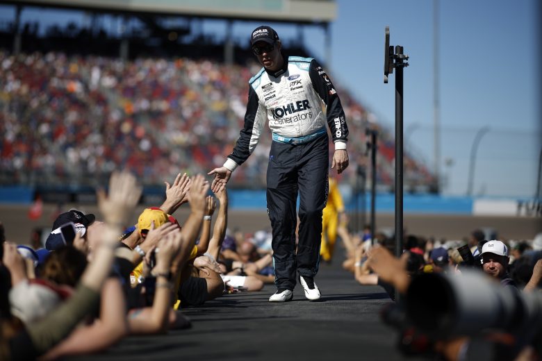 AVONDALE, ARIZONA - NOVEMBER 06: Brad Keselowski, driver of the #6 Kohler Generators Ford, greets fans as he walks onstage during driver intros prior to the NASCAR Cup Series Championship at Phoenix Raceway on November 06, 2022 in Avondale, Arizona. (Photo by Chris Graythen/Getty Images) | Getty Images