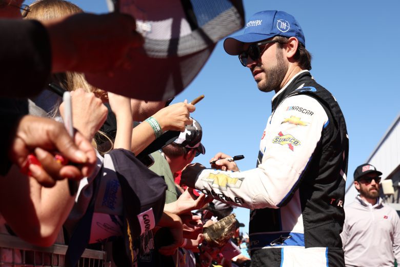 AVONDALE, ARIZONA - NOVEMBER 06: Daniel Suarez, driver of the #99 Freeway Insurance/CommScope Chevrolet, signs autographs for NASCAR fans on the red carpet prior to to the NASCAR Cup Series Championship at Phoenix Raceway on November 06, 2022 in Avondale, Arizona. (Photo by Joe Scarnici/Getty Images) | Getty Images