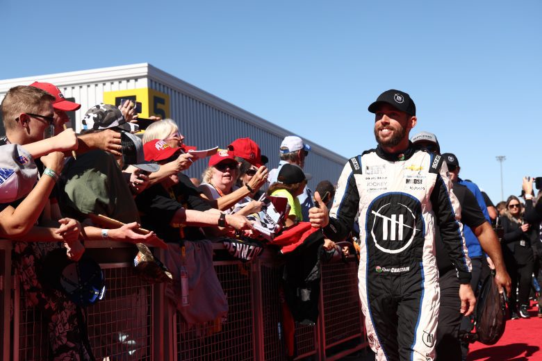 AVONDALE, ARIZONA - NOVEMBER 06: Ross Chastain, driver of the #1 Worldwide Express/Advent Health Chevrolet, greets NASCAR fans on the red carpet prior to the NASCAR Cup Series Championship at Phoenix Raceway on November 06, 2022 in Avondale, Arizona. (Photo by Joe Scarnici/Getty Images) | Getty Images