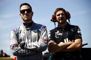 Alex Bowman and crew chief Greg Ives look on at Nashville
