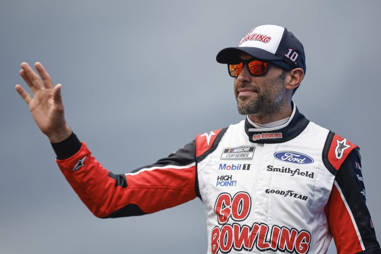 WATKINS GLEN, NEW YORK - AUGUST 21: Aric Almirola, driver of the #10 Go Bowling Ford, waves to fans as he walks onstage during driver intros prior to the NASCAR Cup Series Go Bowling at The Glen at Watkins Glen International on August 21, 2022 in Watkins Glen, New York. (Photo by Sean Gardner/Getty Images) | Getty Images