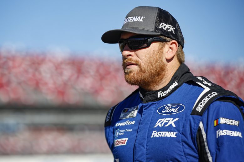 TALLADEGA, ALABAMA - OCTOBER 01: Chris Buescher, driver of the #17 Fastenal Ford, walks the grid during qualifying for the NASCAR Cup Series YellaWood 500 at Talladega Superspeedway on October 01, 2022 in Talladega, Alabama. (Photo by Sean Gardner/Getty Images) | Getty Images