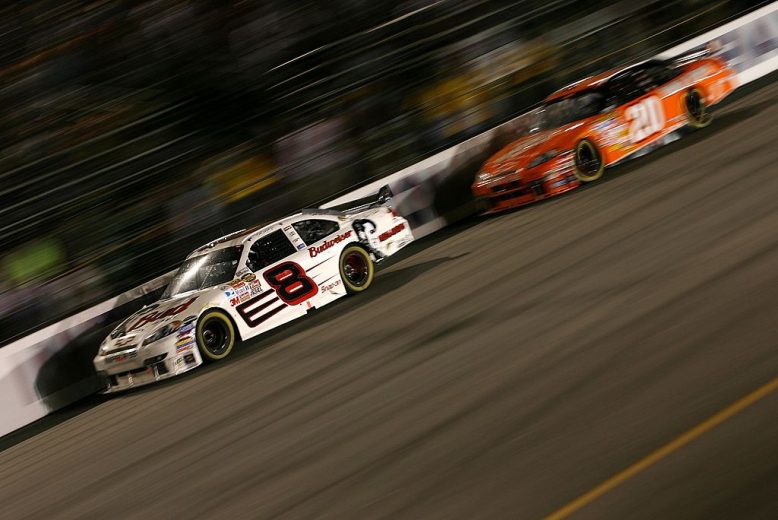 RICHMOND, VA - SEPTEMBER 08:  Dale Earnhardt Jr., driver of the #8 Budweiser/Elvis Chevrolet, leads Tony Stewart, driver of the #20 The Home Depot Chevrolet, during the NASCAR Nextel Cup Series Chevy Rock & Roll 400 at Richmond International Raceway on September 8, 2007 in Richmond, Virginia.  (Photo by Marc Serota/Getty Images for NASCAR) | Getty Images