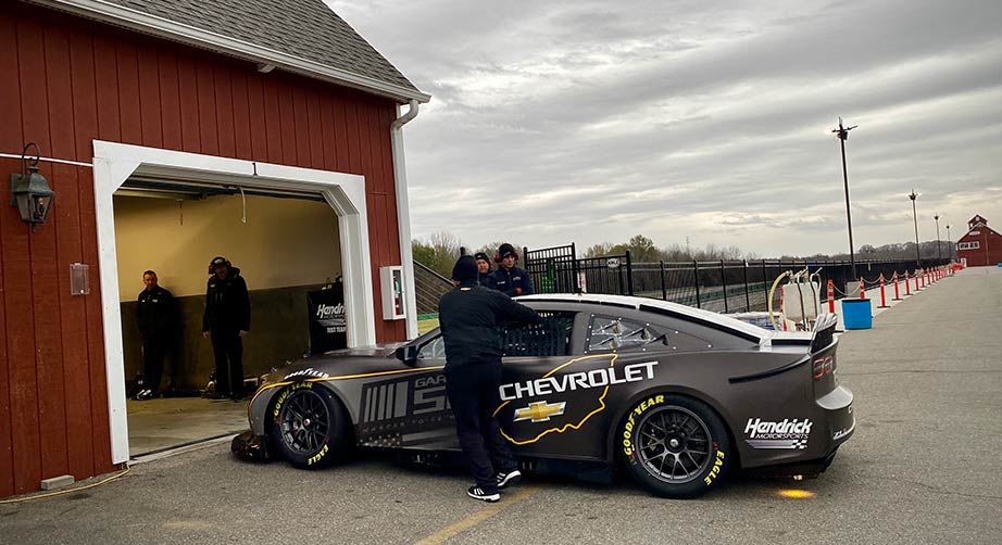 The Garage 56 test car is guided back into the first stall at Virginia International Raceway.