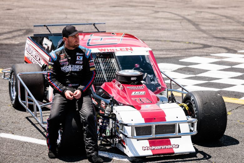 Jon McKennedy diver of the #79 Middlesex Interiors car looks on during the Duel at the Dog 200 for the Whelen Modified Tour at Monadnock Speedway on June 19, 2022 in Winchester, New Hampshire. (Nick Grace/NASCAR)