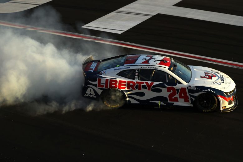 HAMPTON, GEORGIA - MARCH 20: William Byron, driver of the #24 Liberty University Chevrolet, celebrates with a burnout after winning the NASCAR Cup Series Folds of Honor QuikTrip 500 at Atlanta Motor Speedway on March 20, 2022 in Hampton, Georgia. (Photo by Mike Mulholland/Getty Images) | Getty Images
