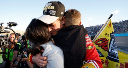 joey logano hugs his family