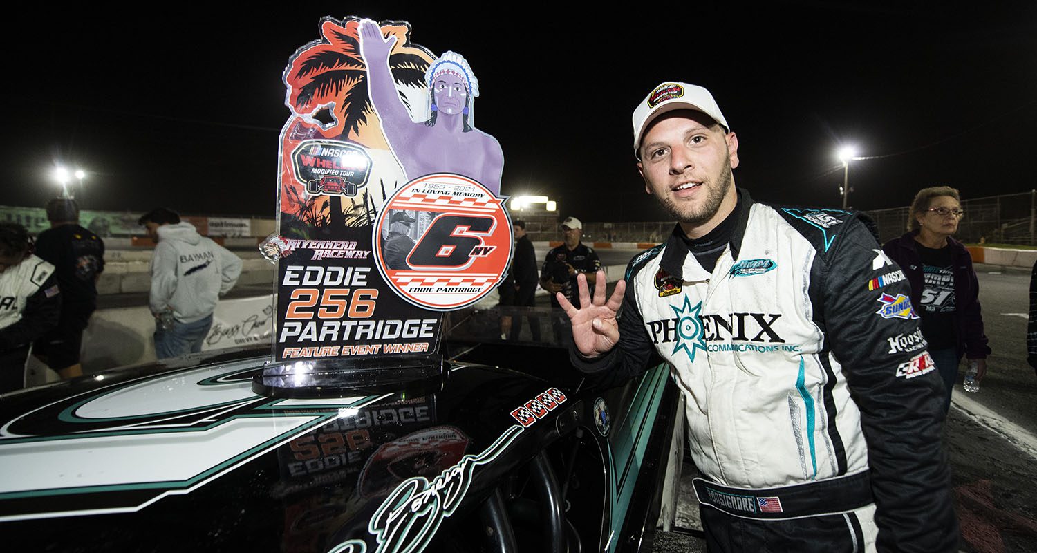 Justin Bonsignore, driver of the #51 Phoenix Communications, Inc., adds a decal to his car during the Eddie Partridge 256 for the Whelen Modified Tour at Riverhead Raceway on September 17, 2022 in Riverhead, New York. (Mike Lawrence/NASCAR)