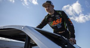 Austin Beers, driver of #64 Lumiere Electrical, Dell Electric, Andrew James Interior, AP Marquadt & Sons Modified gets into his car during the Phoenix Communications 150 for the Whelen Modified Tour at Thompson Speedway Motorsports Park on October 9, 2022 in Thompson, Connecticut. (Rachel O’Driscoll/NASCAR)