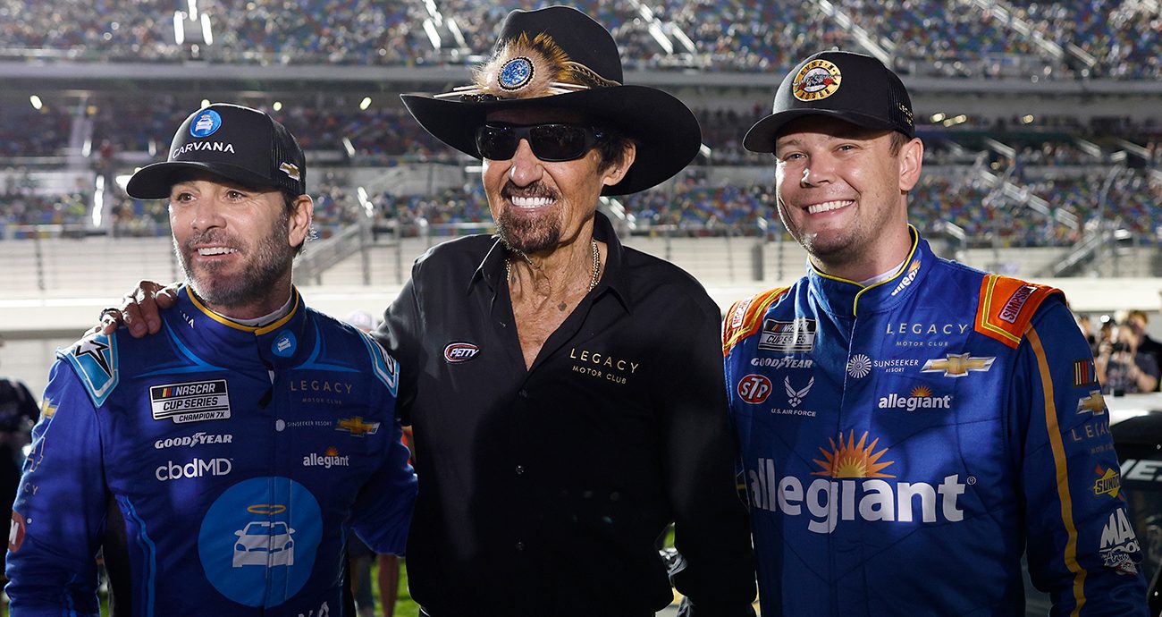 Jimmie Johnson (L), Richard Petty (C) and Erik Jones (R) pose for a photo.